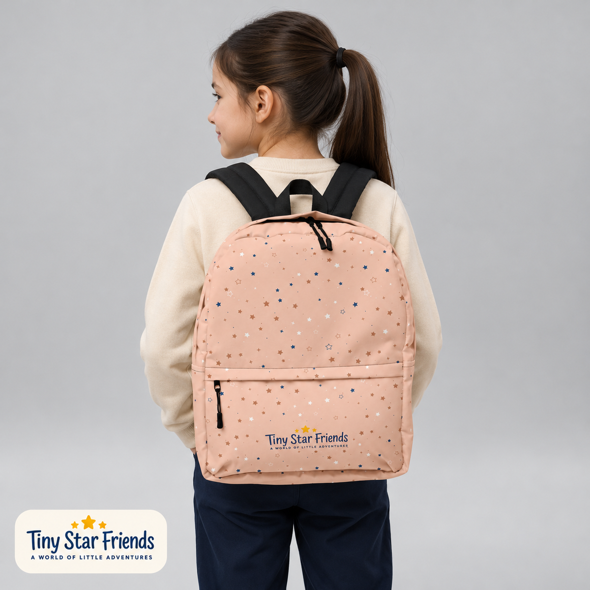 School-age child wearing the Peach Sorbet Signature Stars backpack | Tiny Star Friends™
